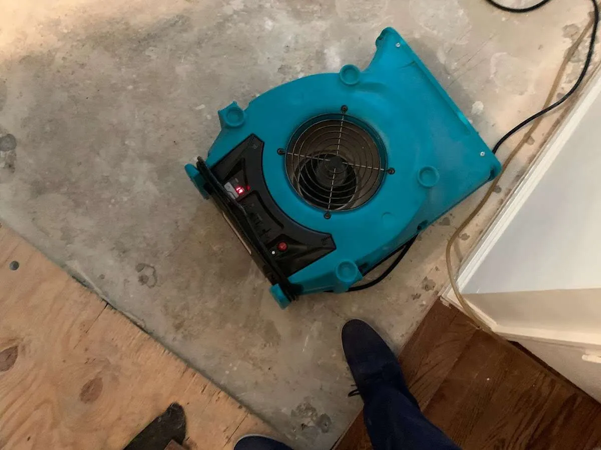 Air mover drying subfloor during Leak Detection & Repair in Skokie